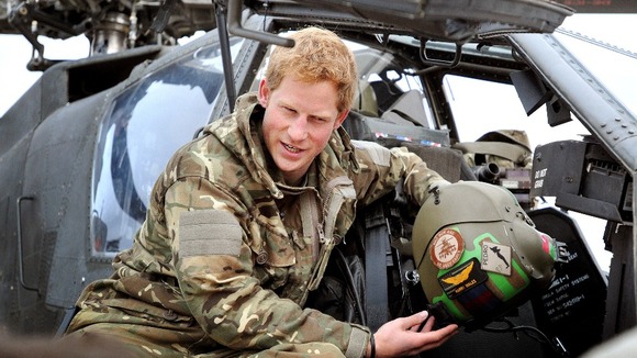Prince Harry makes his early morning pre-flight checks at Camp Bastion, southern Afghanistan.