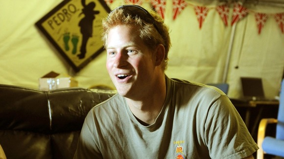 Prince Harry relaxes playing a computer football game with his fellow Apache Helicopter crews.