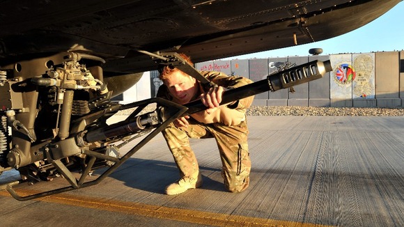 Prince Harry does a flight check on his Apache helicopter.