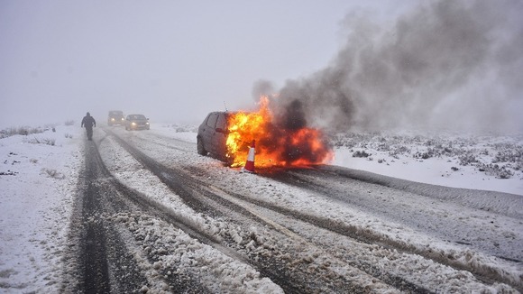 The car on fire on a hill on the B3212 Dartmoor, Devon