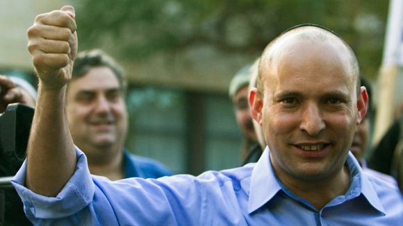 Naftali Bennett, leader of the Bayit Yehudi party, gestures after casting his vote