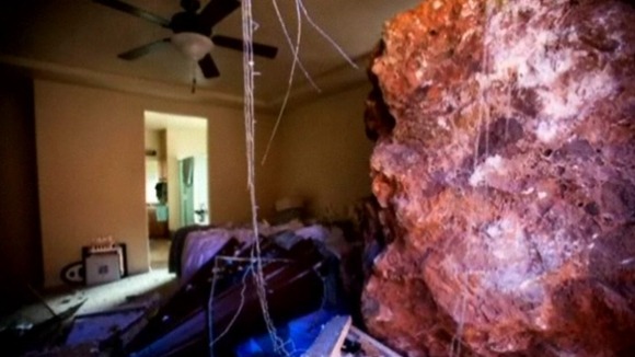 The damaged bedroom of the couple's property in Utah