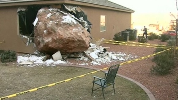 The boulder demolished an entire corner of the property