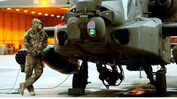 Captain Wales seen in December 2012 making early morning pre-flight checks at Camp Bastion
