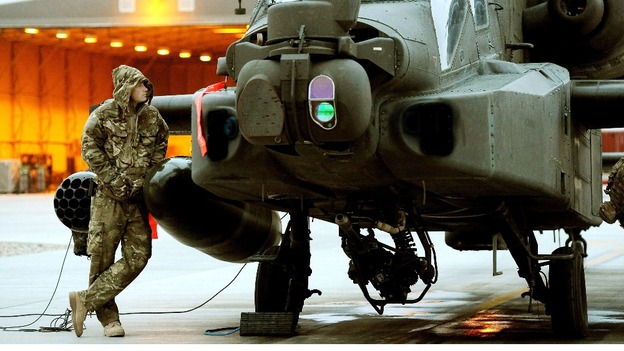 Captain Wales seen in December 2012 making early morning pre-flight checks at Camp Bastion