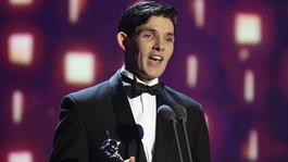 Coin Morgan accepts the award for Best Male Drama Performance for Merlin during the 2013 National Television Awards at the O2 Arena