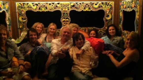 The group looked very cosy as they relaxed on the island