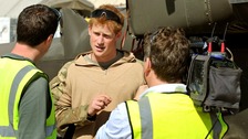 Prince Harry in November 2012 giving a TV interview by his helicopter in Camp Bastion