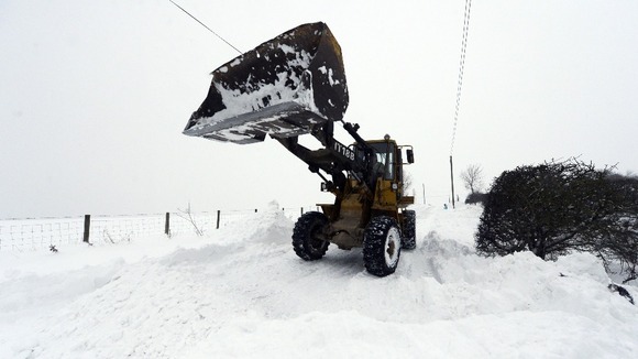 Shovelling snow in Tanfield County, Durham.