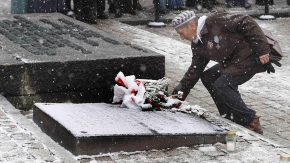 Man at gravestone