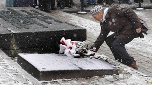 Man at gravestone