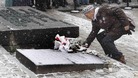 Man at gravestone