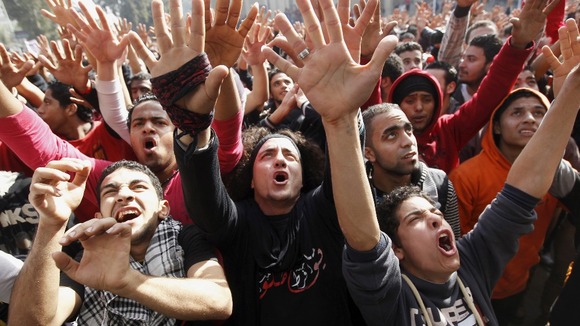 Al-Ahly fans, also known as Ultras, celebrate the death sentences, outside their club in Cairo.