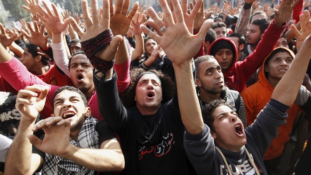 Al-Ahly fans, also known as Ultras, celebrate the death sentences, outside their club in Cairo.