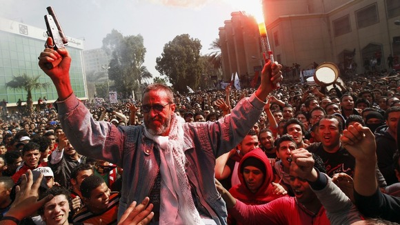 The father of an Al-Ahly fan who was killed in Port Said celebrates with fans in Cairo