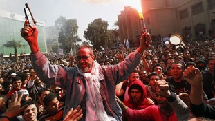 The father of an Al-Ahly fan who was killed in Port Said celebrates with fans in Cairo
