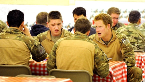 Prince Harry with fellow air crew in the DFAC (Dining Facility)