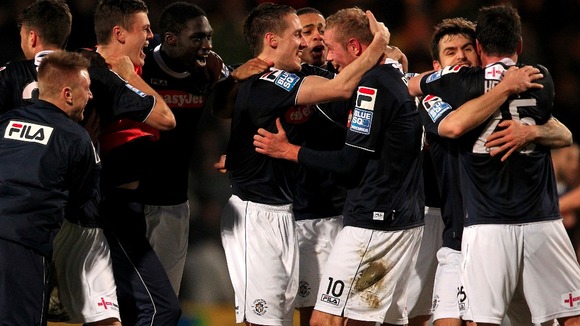 Luton Town's players celebrate their victory over Norwich City at the end of the match