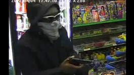 Robber holds gun up at Leicester shopkeeper
