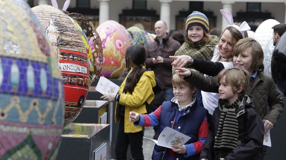 People admiring the eggs.