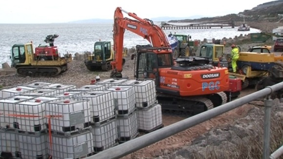 Machinery brought in to remove fuel from HV Carrier