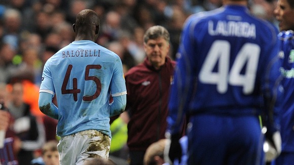 Balotelli leaving pitch after being sent off for a foul on Dynamo Kiev's Goran Popov