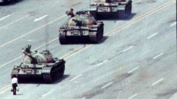A Beijing citizen stands in front of tanks on the Avenue of Eternal Peace in this June 5, 1989