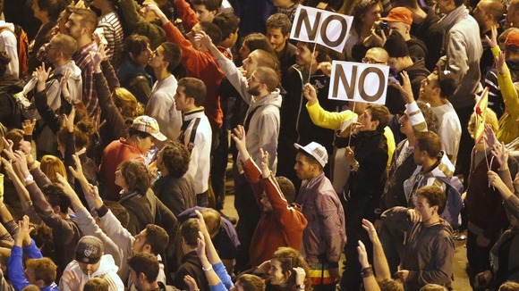 Protesters shout slogans during a demonstration outside Madrid's Parliament in September 2012