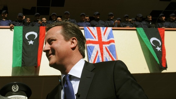 David Cameron meets recruits at a police training college in Tripoli