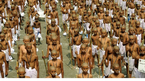 School children dressed as Mahatma Gandhi mark his anniversary
