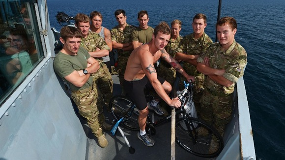 The Marines with their bike on the bridge wing.