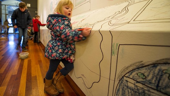 Hannah Skryne, aged three, draws at York Art Gallery