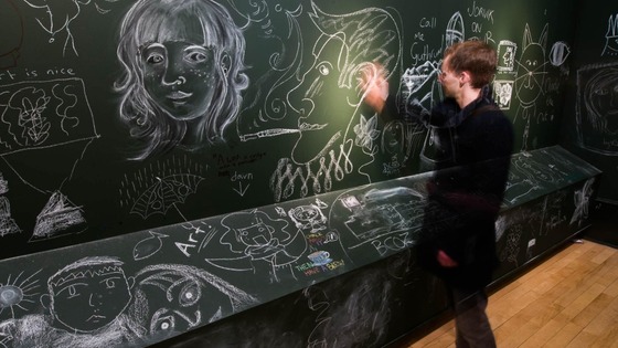 Lee Clark works on his drawing at today's event
