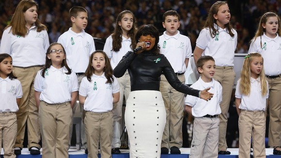 Singer Jennifer Hudson performs "America the Beautiful" with the Sandy Hook Elementary School Choir.