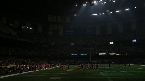 The lights go out during the third quarter of the match, plunging the stadium into darkness.