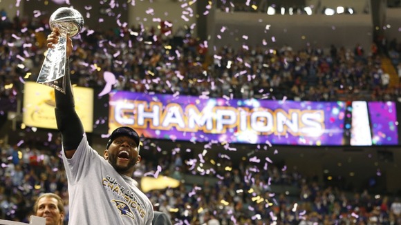 Baltimore Ravens inside linebacker Ray Lewis hoists the Vince Lombardi Trophy as he celebrates victory over the San Francisco 49ers.