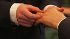 hands exchanging rings
