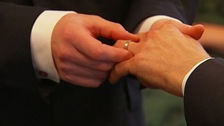 hands exchanging rings