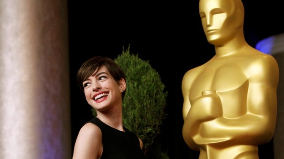 Anne Hathaway, nominated for Actress in a Supporting Role for Les Miserables, poses for photographers.