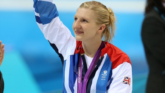 Rebecca Adlington waves to the crows after the medal ceremony for the Women's 800m Freestyle at London 2012