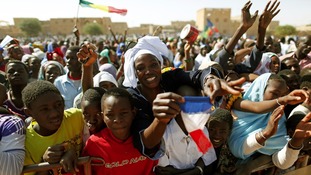 Crowds greeting the French President Francois Hollande