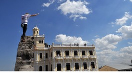 Alain Robert of France scales the walls of a school in the old quarter of Havana. 