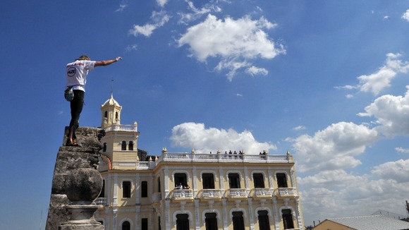 Alain Robert of France scales the walls of a school in the old quarter of Havana.