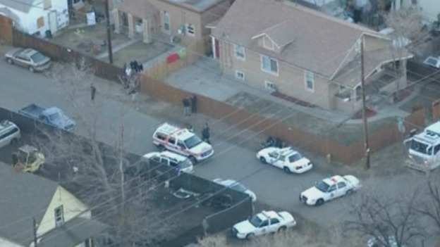 Police surround the house where the fatal shooting tool place