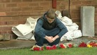 Ethan's friend lays flowers at his home in Sheldon