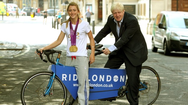 Boris Johnson and Laura Trott announcing the initiative during last summer's Olympics