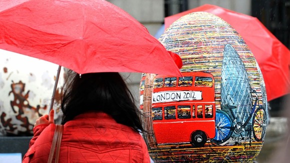 A woman armed with an umbrella in London's Covent Garden.