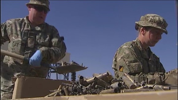 British troop sorting through old bullet casings at Camp Bastion