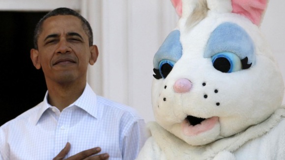 President Barack Obama stands next to the Easter Bunny during the singing of the National Anthem, at the White House in Washington
