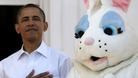 President Barack Obama stands next to the Easter Bunny during the singing of the National Anthem, at the White House in Washington